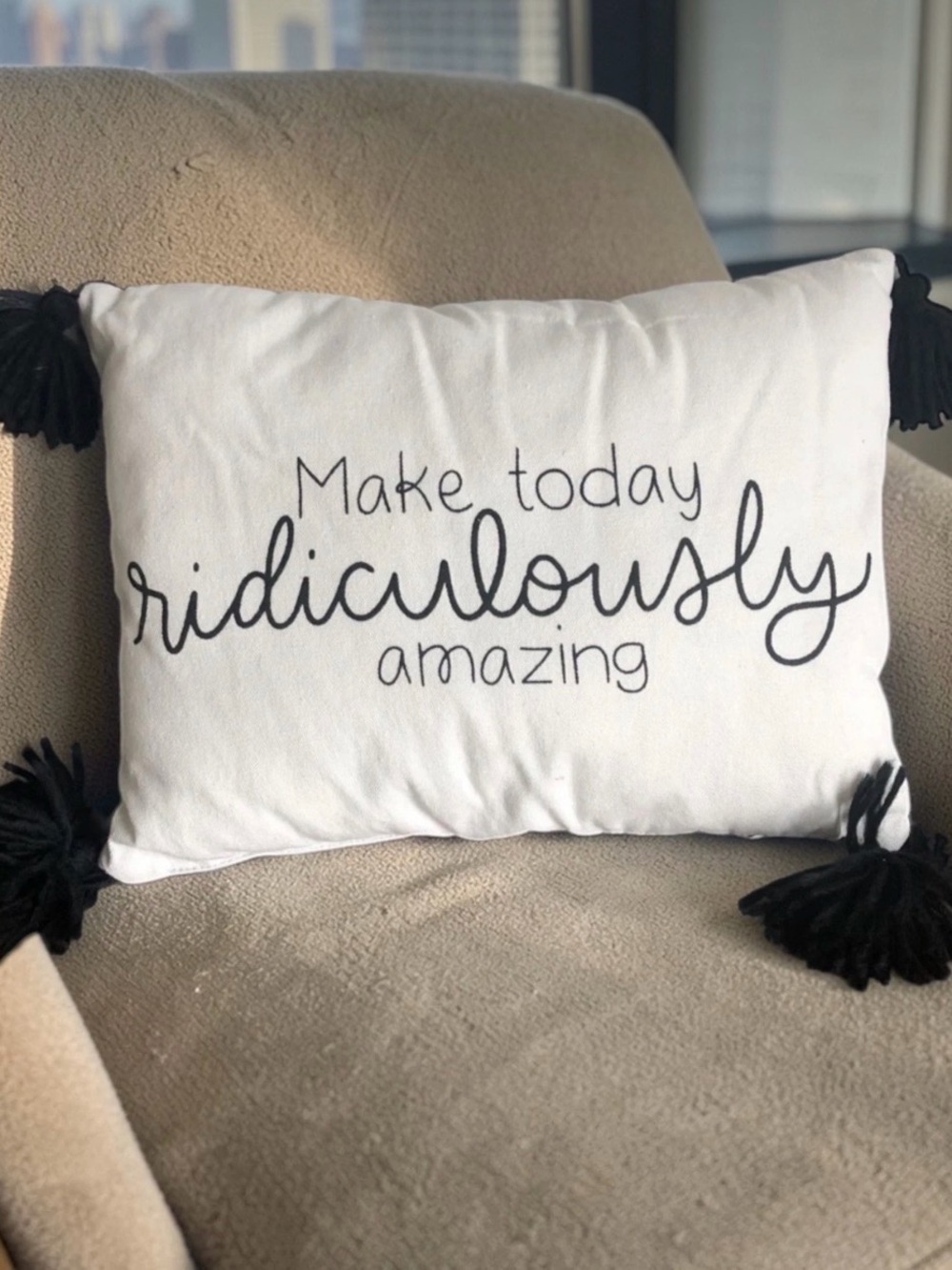 White Decorative Pillow with Black Script and Tassels